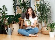 Woman Sitting on floor With Houseplants