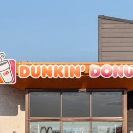 The exterior sign of a Dunkin' Donuts location