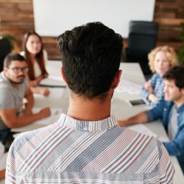 man running a work meeting where they must include a few 'fun facts about me'