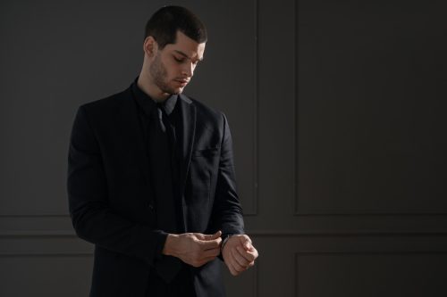 man in all-black suit