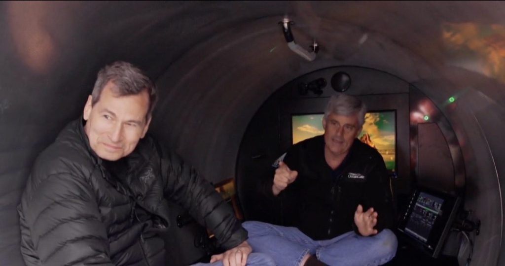A reporter and CEO sitting inside the Titan submersible while it's on a ship