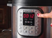 woman turning on instant pot