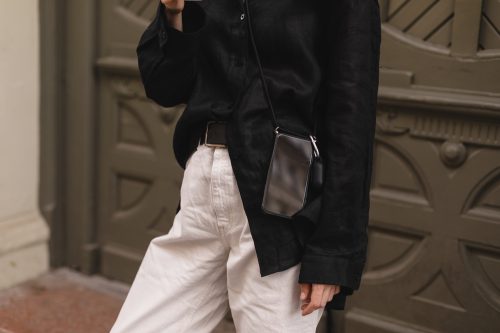 Neutral street style concept with khaki pants and black button-down blouse