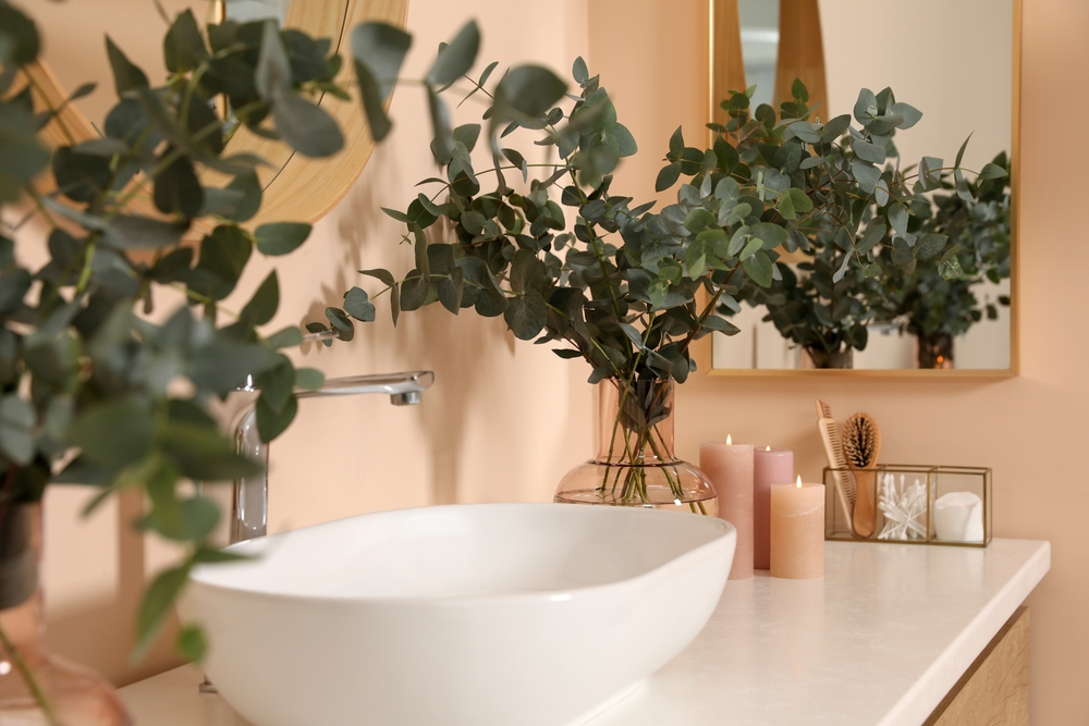 Bathroom sink with candles and eucalyptus