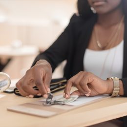 woman tipping in cash