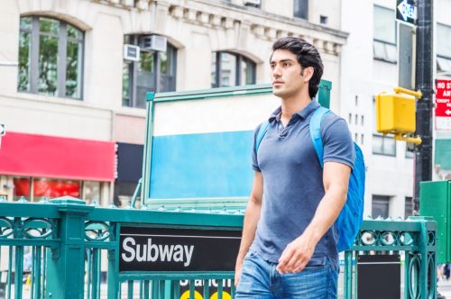 young man walking in New York City