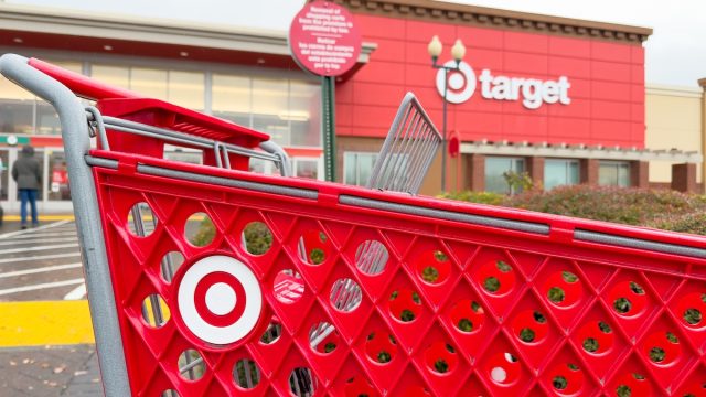 Target shopping cart with a store in the background