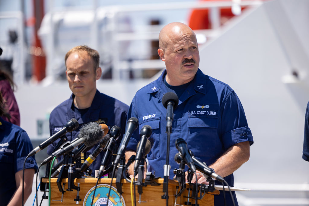Capt. Jamie Frederick of the U.S. Coast Guard, joined by others from the U.S. Navy, Royal Navy and Woods Hole Oceanographic Institute, gives an update on the search efforts for five people aboard a missing submersible approximately 900 miles off Cape Cod, on June 21, 2023 in Boston, Massachusetts.