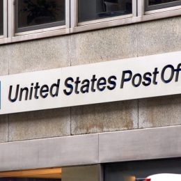 Logo and signage of USPS on a wall. United States Postal Service is an independent agenc of US federal government responsible for providing postal service in the US