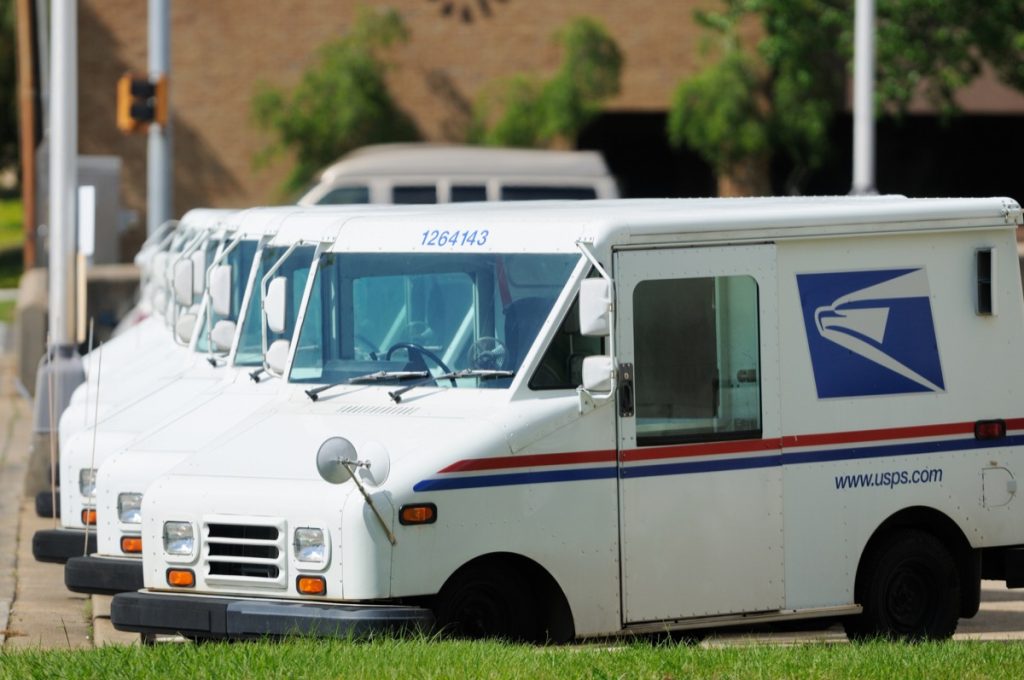 Mail trucks parked outside USPS office