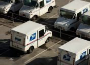 A USPS (United States Postal Service) mail truck parks for the evening.