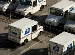 A USPS (United States Postal Service) mail truck parks for the evening.
