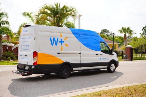 Tampa, FL USA -03 01 2023: Walmart membership W plus shutter bus for free shipping and ordering groceries online for delivery