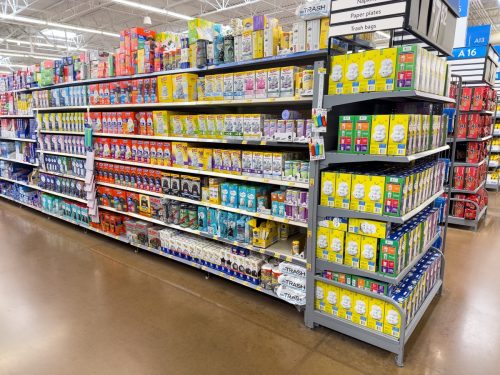 Closeup of neatly organized shelves of household goods at Walmart Super Center store.