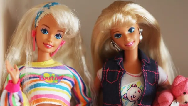 Two Barbie dolls side by side
