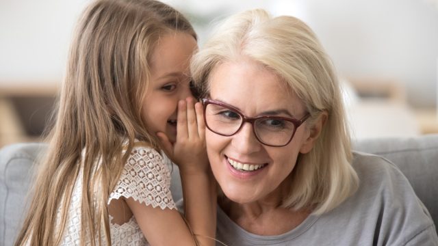 Grandma and Granddaughter Sharing secrets
