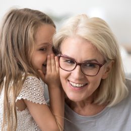 Grandma and Granddaughter Sharing secrets
