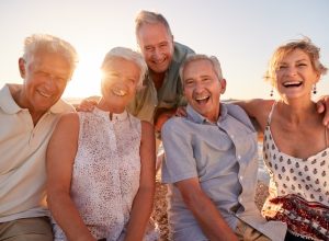 Group of Senior Friends Hanging Out on the Beach