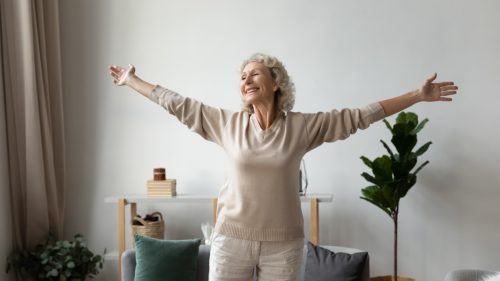 Happy Senior Woman Smiling in Living Room