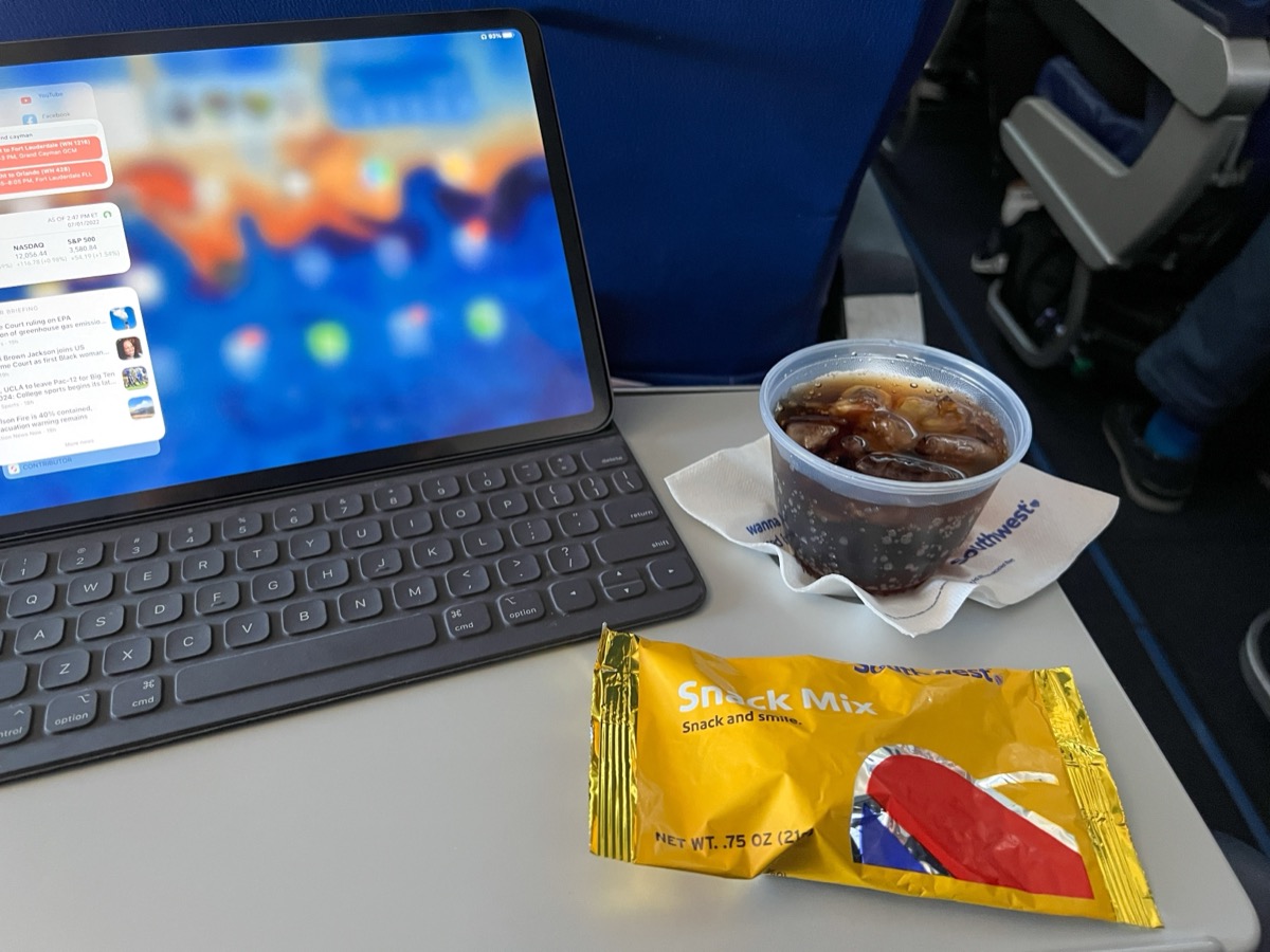 Orlando, FL USA - July 1, 2022: A drink and snack in front of a computer from a flight on Southwest Airlines Co.