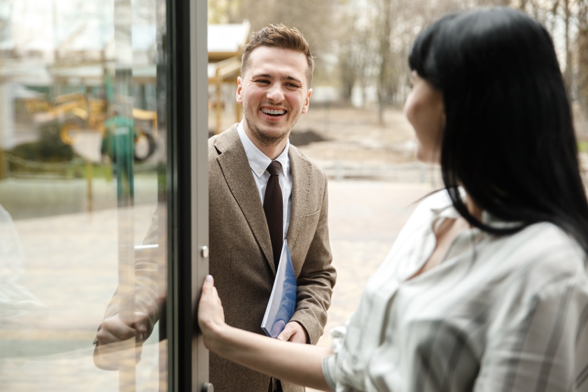 Woman Holding the Door Open