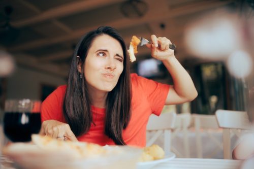 Woman Overanalyzing her Food