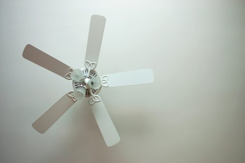 White ceiling fan against white ceiling
