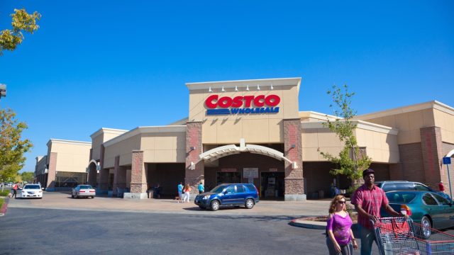 Citrus Heights, California, USA - September 9, 2014: Customers walking in and out of Costco Wholesale store in Citrus Heights, California on a sunny afternoon . Costco is known for discounted prices on its merchandise. Costco Wholesale operates an international chain of membership warehouses, carrying brand name merchandise at substantially lower prices.