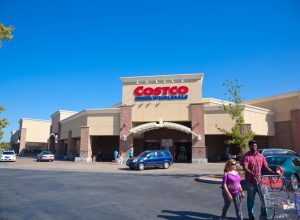Citrus Heights, California, USA - September 9, 2014: Customers walking in and out of Costco Wholesale store in Citrus Heights, California on a sunny afternoon . Costco is known for discounted prices on its merchandise. Costco Wholesale operates an international chain of membership warehouses, carrying brand name merchandise at substantially lower prices.