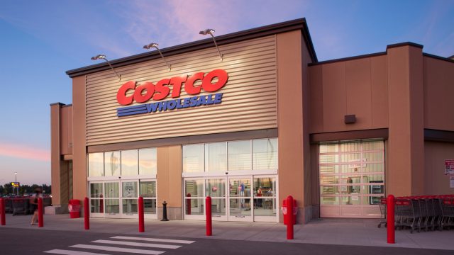 A Costco storefront at dusk