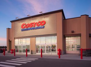 A Costco storefront at dusk