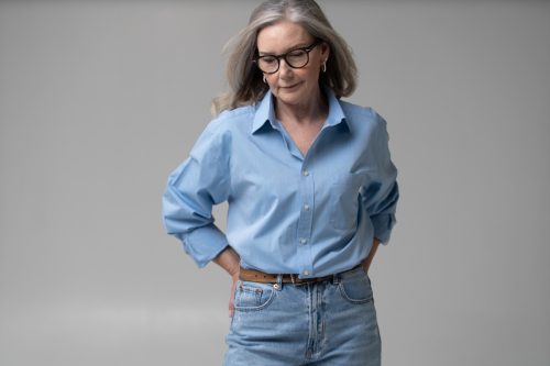 middle-aged woman wearing high-waisted jeans