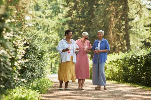 older women walking together in summer