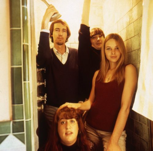 The Mamas & the Papas posing for an album cover in 1966