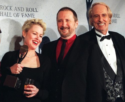 Michelle Phillips, Denny Doherty, and John Phillips after being inducted into the Rock and Roll Hall of Fame in 1998