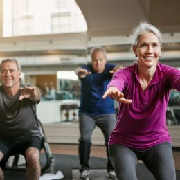 Shot of a senior group of woman and men working out together at the gym