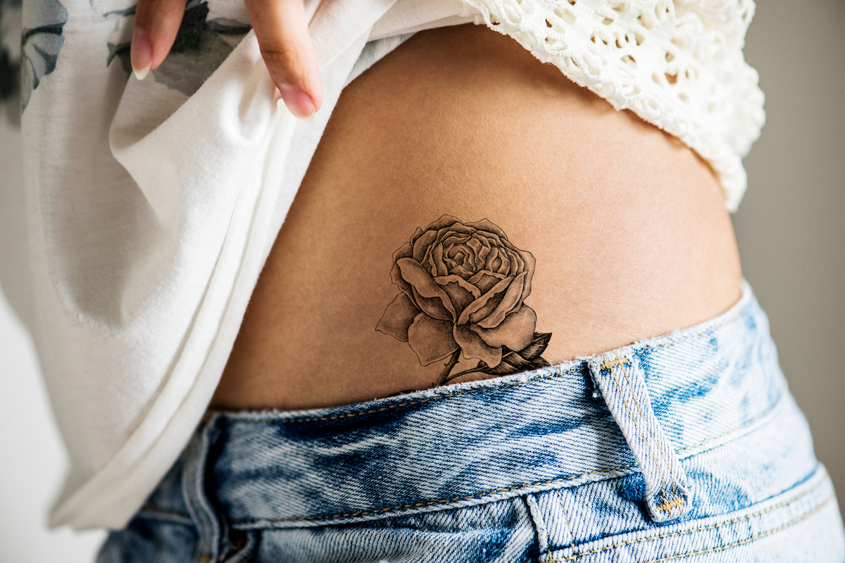 rose tattoo on side