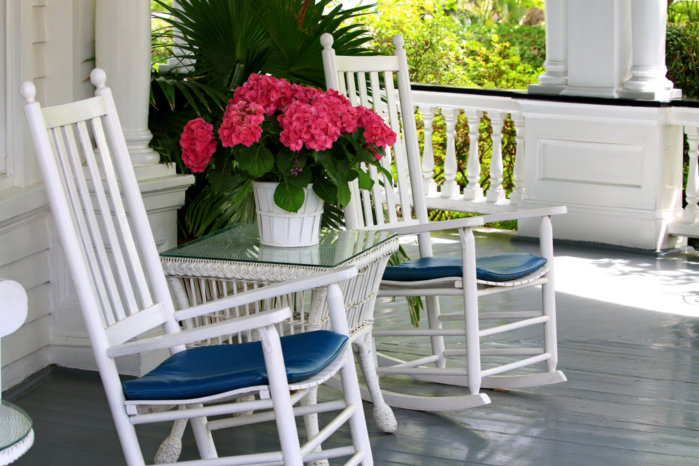 Beautiful porch with rocking chairs and flowers