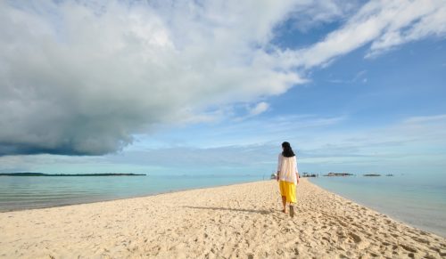 woman on peaceful beach walk