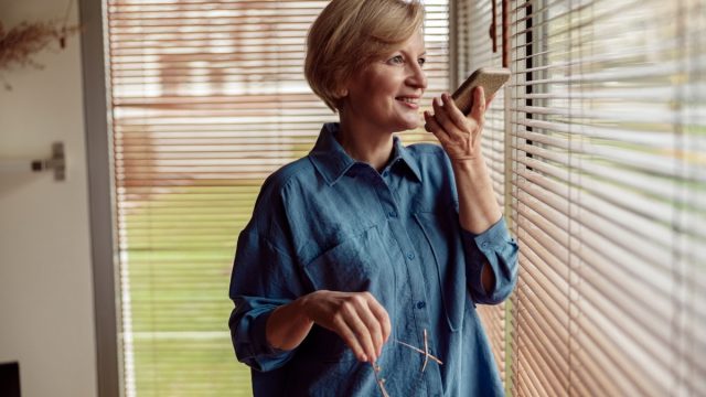 middle-aged woman talking into phone