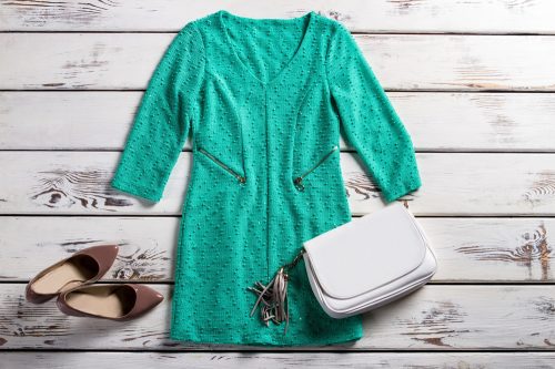 Turquoise dress with white purse and brown heels