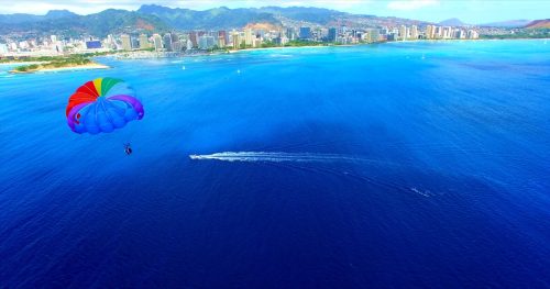 parasailing off the coast of honolulu