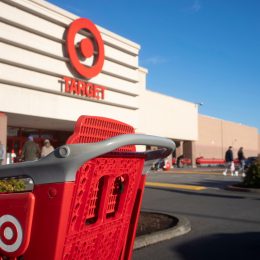 A shopping cart in front of a Target storefront