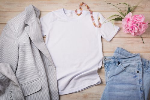 White womenâ€™s cotton T-shirt mockup with blue jeans, pink flower and gray striped blazer. Design t shirt template, tee print presentation mock up