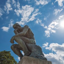 View of famous statue of Rodin's The Thinker on sunny day on Paris, France