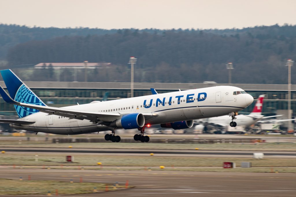 A United Airlines flight taking off from an airport