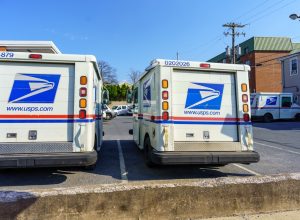 USPA Mail delivery trucks parked at the Ephrata Post Office in Lancaster County, PA.