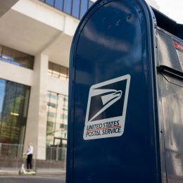 A close up of a USPS mailbox