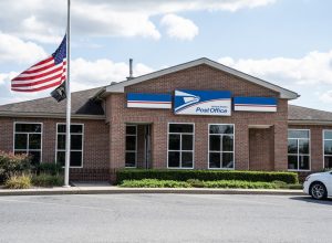 Flag at half staff infront USPO building.