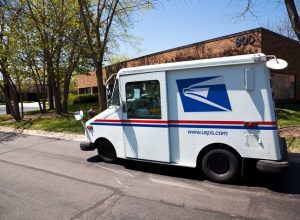 United States Postal Service delivery truck distributing mail in office complex in Northbrook - suburban town north of Chicago.